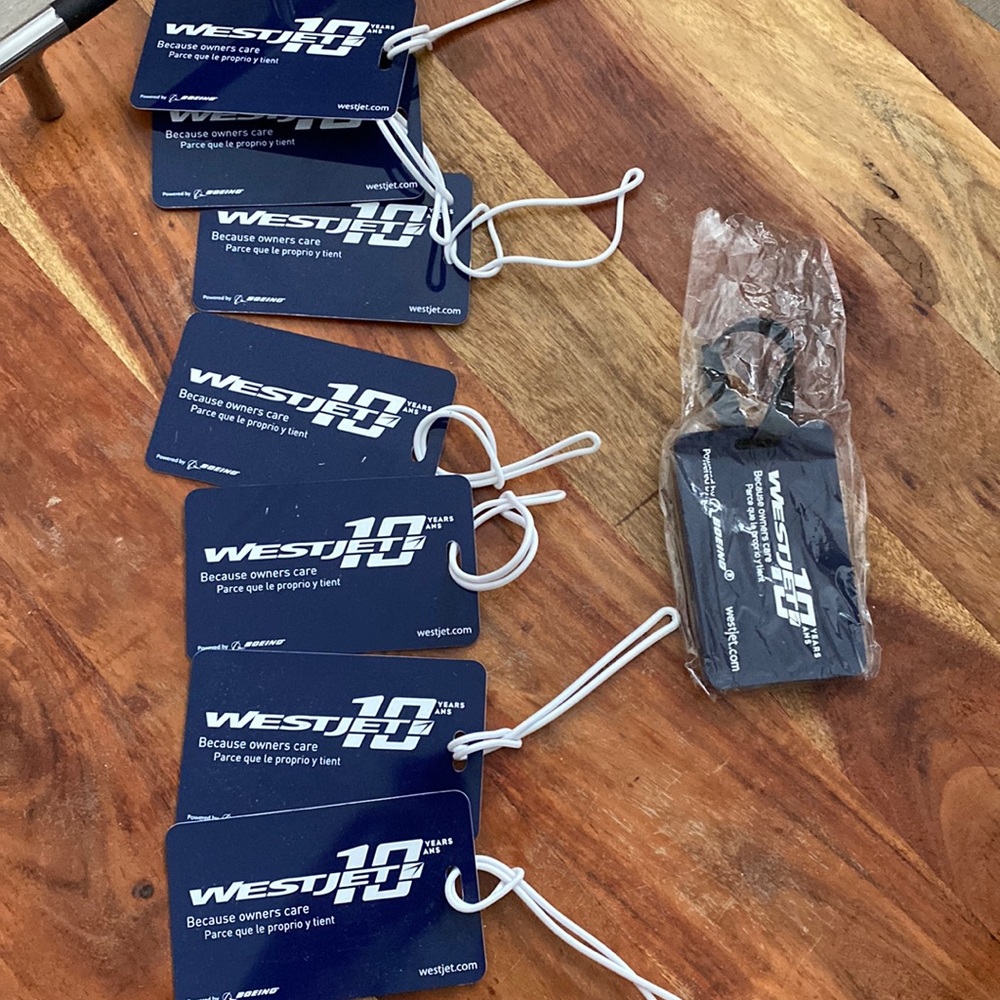 NWT WESTJET AIRLINES 10th anniversary luggage tags lot of 8
